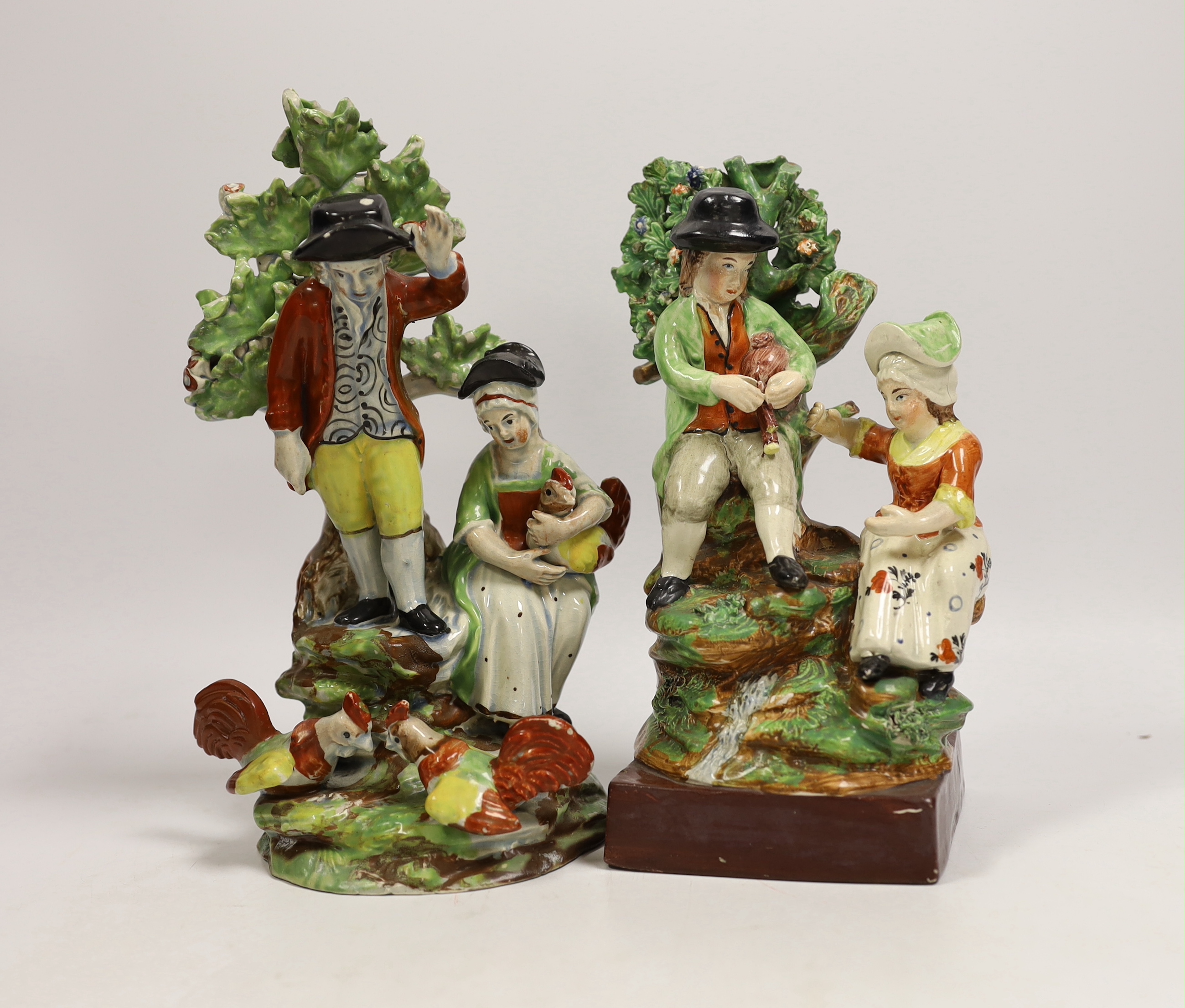 Two Staffordshire groups of couples beside chickens and a stream, c.1820-30 and mid 19th century, tallest 23cm